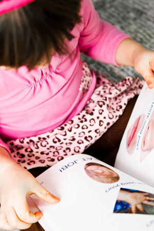 Little girl reading book